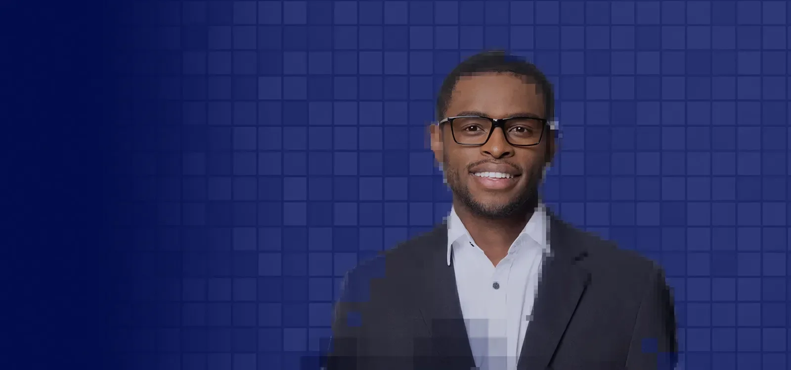 Smiling man wearing a suit and glasses