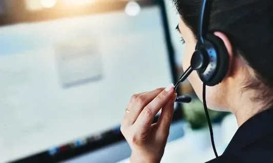 Person Talking on Headset at Work