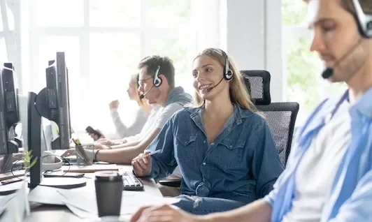 Woman in Office Talking on Headset